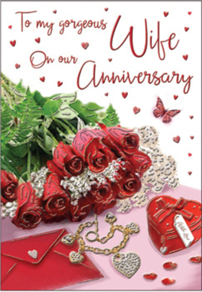 A richly detailed anniversary card unfolds like a memory box arranged on a dresser in an Addington home. At its centre, a classic bouquet of red roses takes pride of place, each bloom luxuriously full, with layers of velvety petals opening to reveal deep crimson hearts. The roses are elegantly wrapped and interwoven with lush green foliage, the contrast heightening their intensity and recalling the natural calm of the countryside edging Addington. Around this floral focal point, a series of intimate touches invite closer attention: a jewellery set that glimmers softly, a vivid red box suggesting a special gift, and a heart-shaped trinket that could easily be a keepsake from an early anniversary. Lace-like patterns and fine heart motifs thread through the design, adding delicate texture and a sense of craftsmanship. An envelope rests nearby, poised to hold an anniversary message filled with gratitude and affection. The lighting is soft and flattering, casting a gentle glow across the composition, picking up the sheen of metal, the subtle shine of ribbon, and the plush depth of the roses. Hues of ruby red, warm gold, and creamy white blend into an atmosphere of warmth and reassurance, reminiscent of a cosy evening celebration after flowers have been delivered across Addington. Every carefully placed element-from the romantic script to the interplay of velvet petals, glossy surfaces, and smooth jewellery-evokes closeness, making the scene feel like a visual embrace in honour of a much-loved relationship.