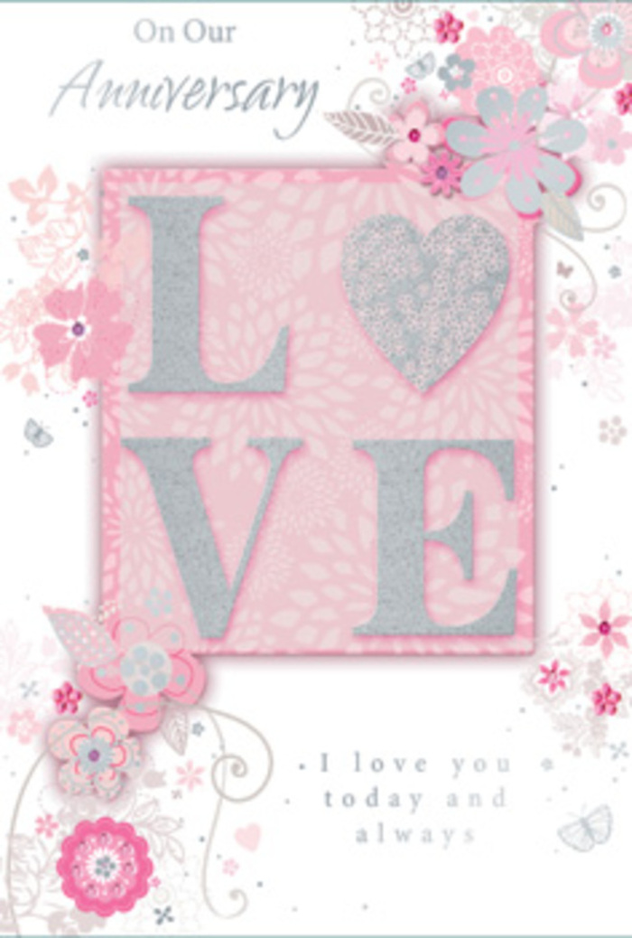 The photograph shows an anniversary card whose design feels like a gentle tribute to enduring love, the kind of keepsake a couple in Addington might tuck away after many shared celebrations. At the centre, the word LOVE is prominently displayed in raised lettering, coated with a soft, frosted glitter that glows in tones of pearly white and light silver. The surface looks almost powdery and tactile, promising a subtle texture to the touch. This central word rests against a smooth blush-pink field, which deepens to slightly richer pink tones near the edges, giving the card a cushioned, almost cloud-like quality. Around the main motif, fine, hand-drawn floral illustrations weave in loose, organic clusters. Small blossoms with rounded petals, slender buds, and delicate leaves appear in an understated palette of blush, lilac, ivory, and silvery grey, much like the gentle colours a local florist might choose for a romantic bouquet echoing Addington's calm, leafy atmosphere. Thin, curling stems and decorative flourishes arc and loop around the flowers, guiding the eye in a soft circular motion. Here and there, almost-hidden butterflies and whimsical swirls lend a quiet sense of movement, as if the blooms are drifting across the card. A heartfelt inscription-similar in sentiment to I love you today and always-is printed in a graceful script, its lines slender and unfussy, ensuring the message feels personal rather than formal. Together, the glittered LOVE, the pastel florals, and the elegant typography create an impression of serene joy and lasting affection, making the card feel like a paper bouquet carefully composed for an anniversary evening in Addington.